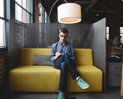 company-couch-coworking-guy