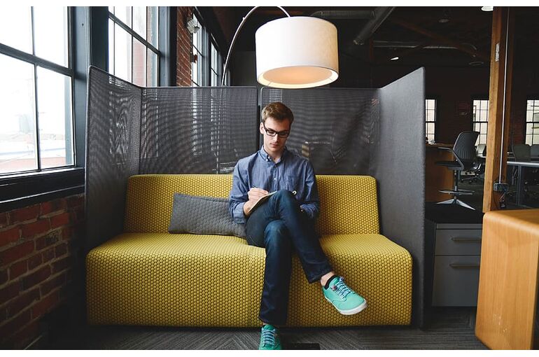 company-couch-coworking-guy
