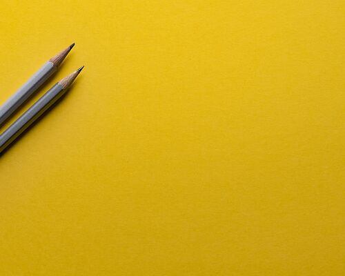 yellow-background-pencil-designer
